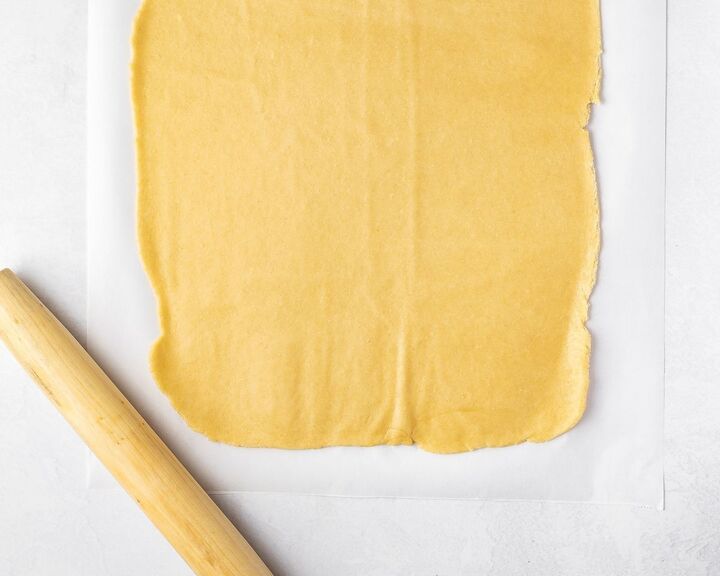 Babka dough rolled out with a rolling pin.