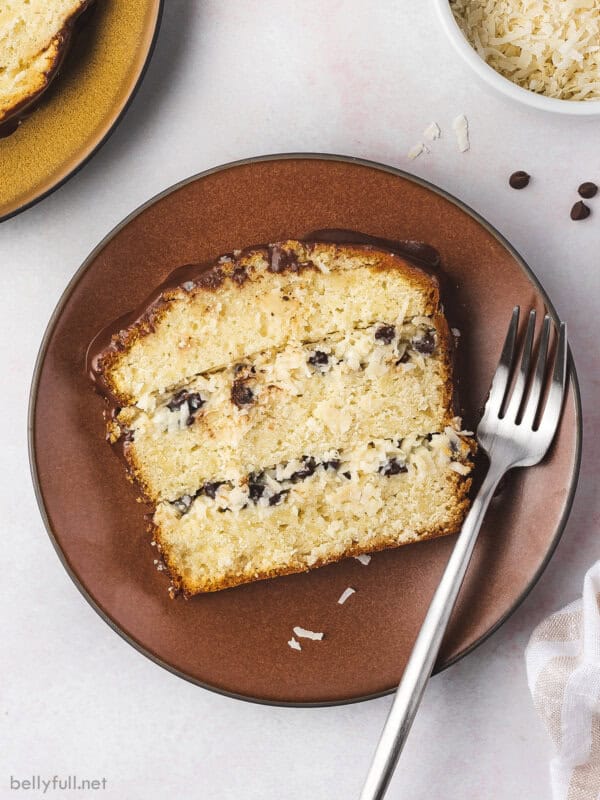 overhead slice of layered coconut pound cake on plate with fork