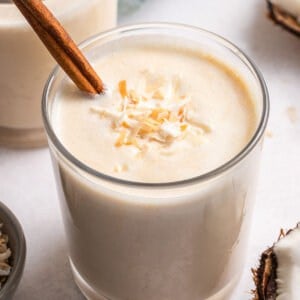 Angled view of a glass of coquito