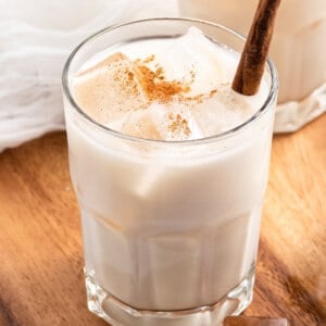 Cinnamon infused rice milk over ice in glass