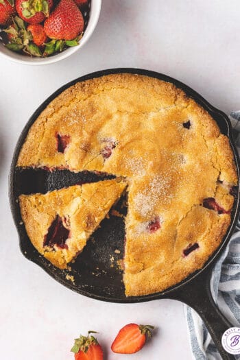 overhead sliced cake in cast iron skillet