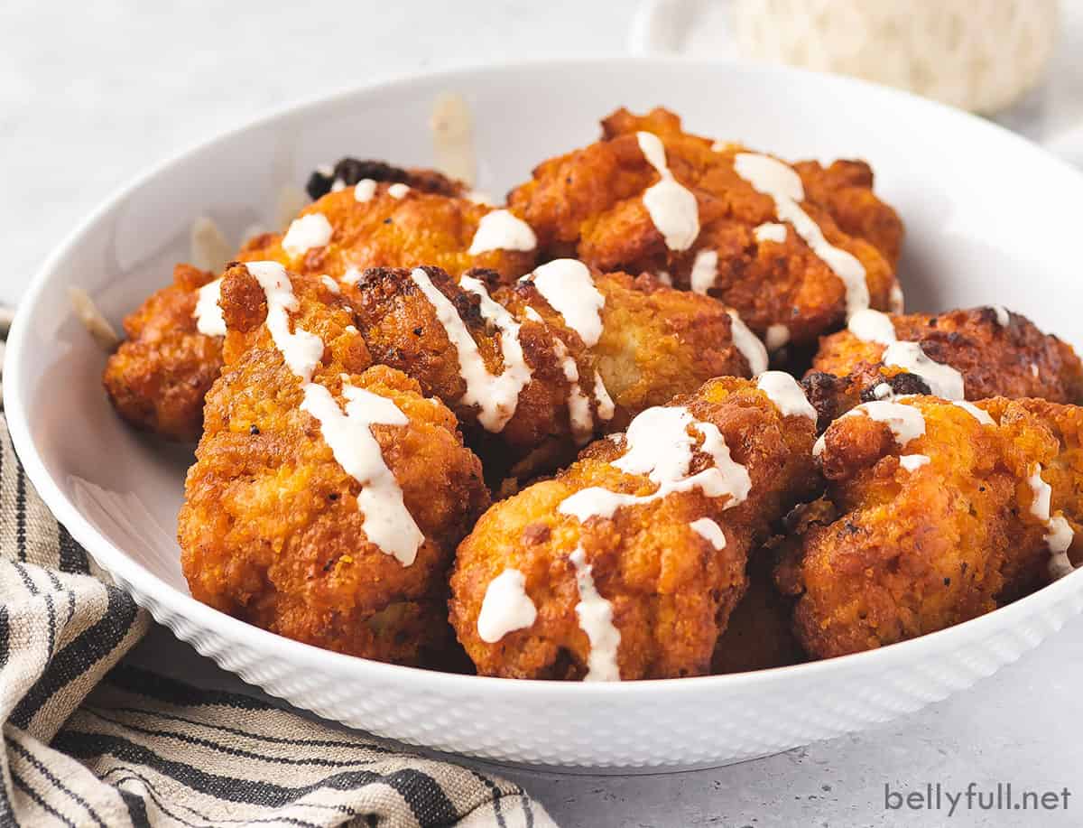 Chicken tenders drizzled with Alabama white sauce