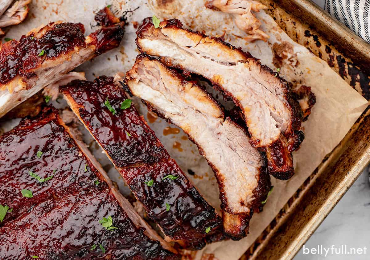 Overhead view of instant pot baby back ribs on a baking sheet