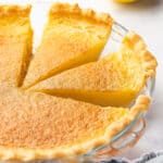 side view of lemon curd pie with 2 slices