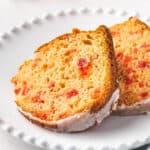 2 slices of cherry bundt cake on white plate