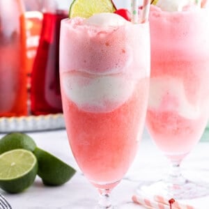 shirley temple ice cream float with straw and a lime wedge