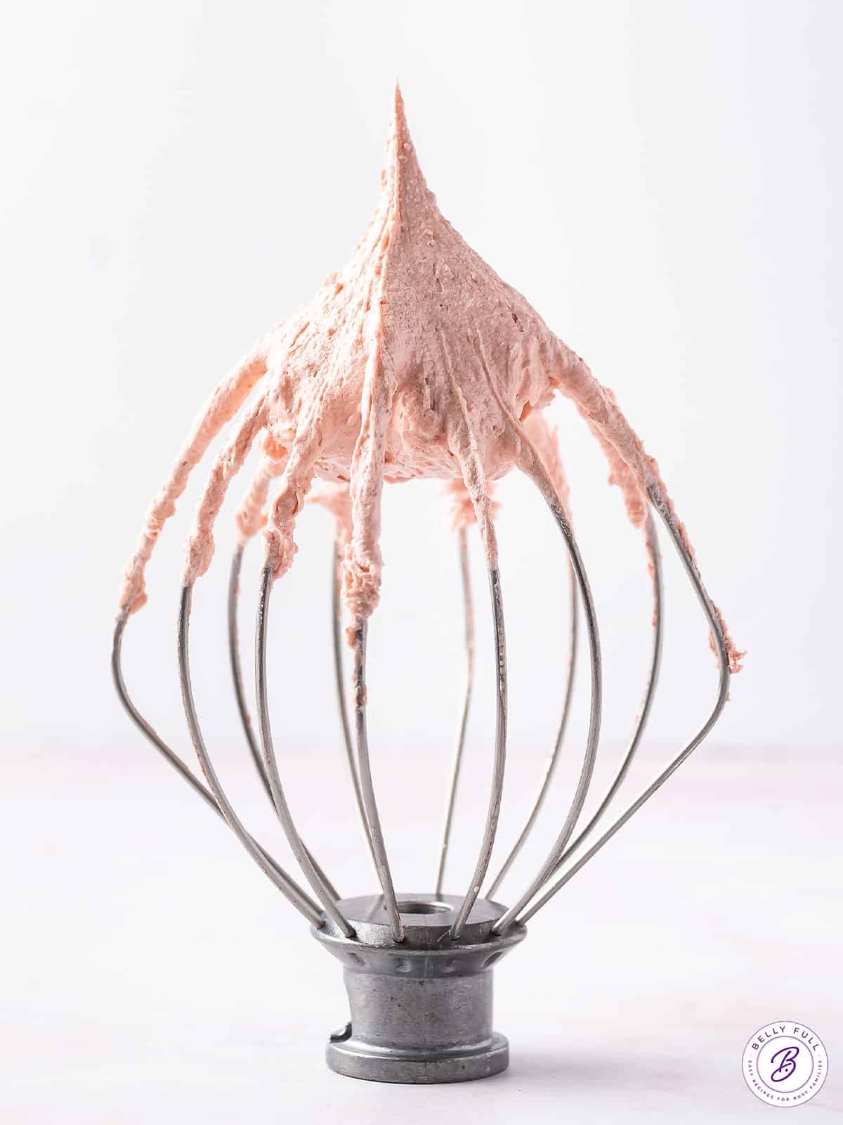 strawberry frosting on large whisk attachment