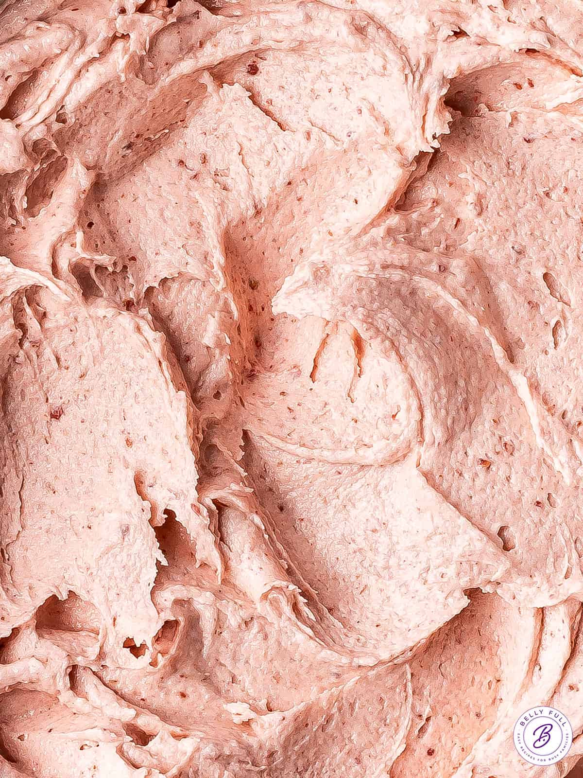 zoomed in close up of strawberry frosting