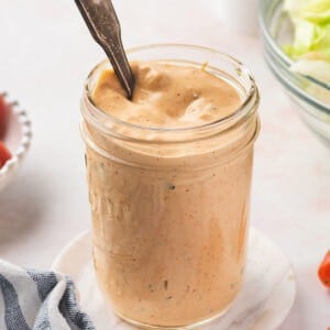 A spoon in a jar of homemade thousand island dressing