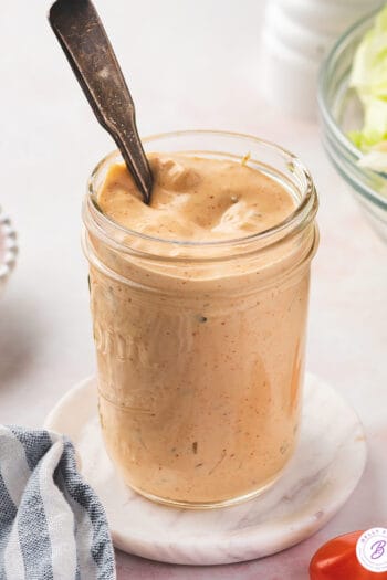 A spoon in a jar of homemade thousand island dressing