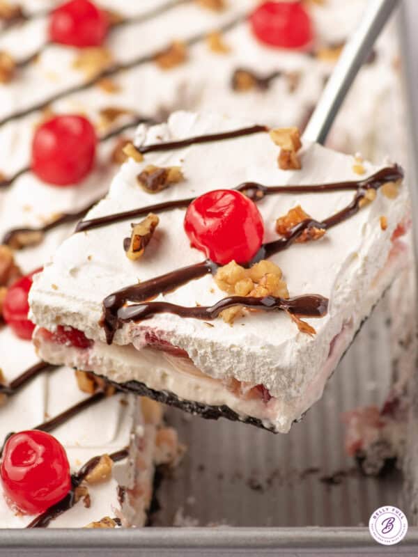close up piece of banana split lush dessert on serving spatula
