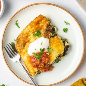 overhead square portion of chile relleno casserole on plate with fork