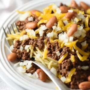 Cincinnati chili on white plate with fork
