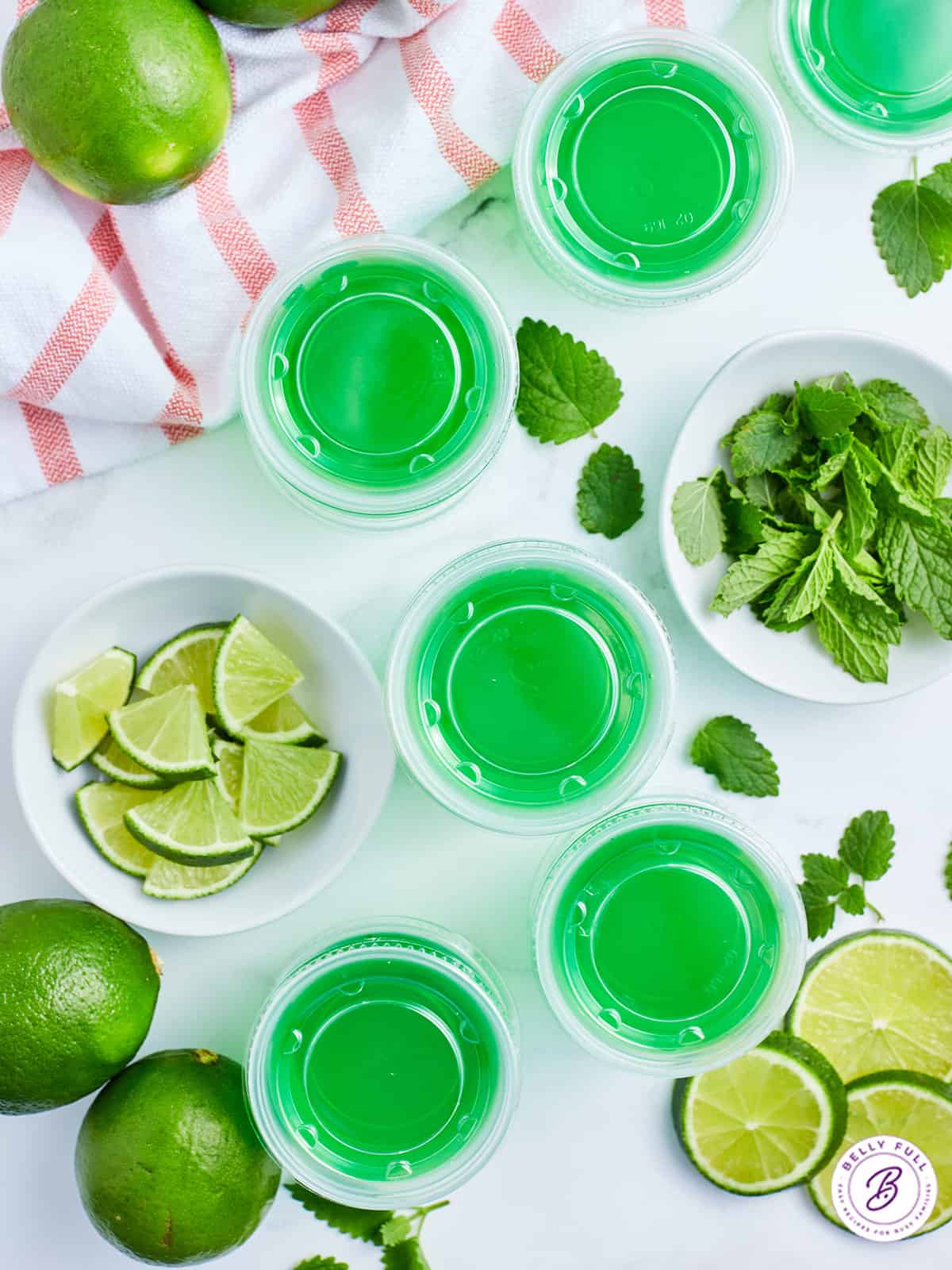 overhead lime green jello shots with lids