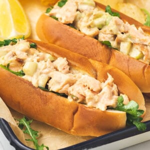 close up hot dog bun stuffed with salmon salad