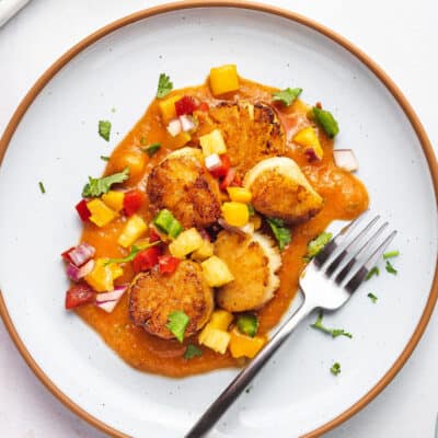 Overhead view of fruit salsa topped with seared scallops