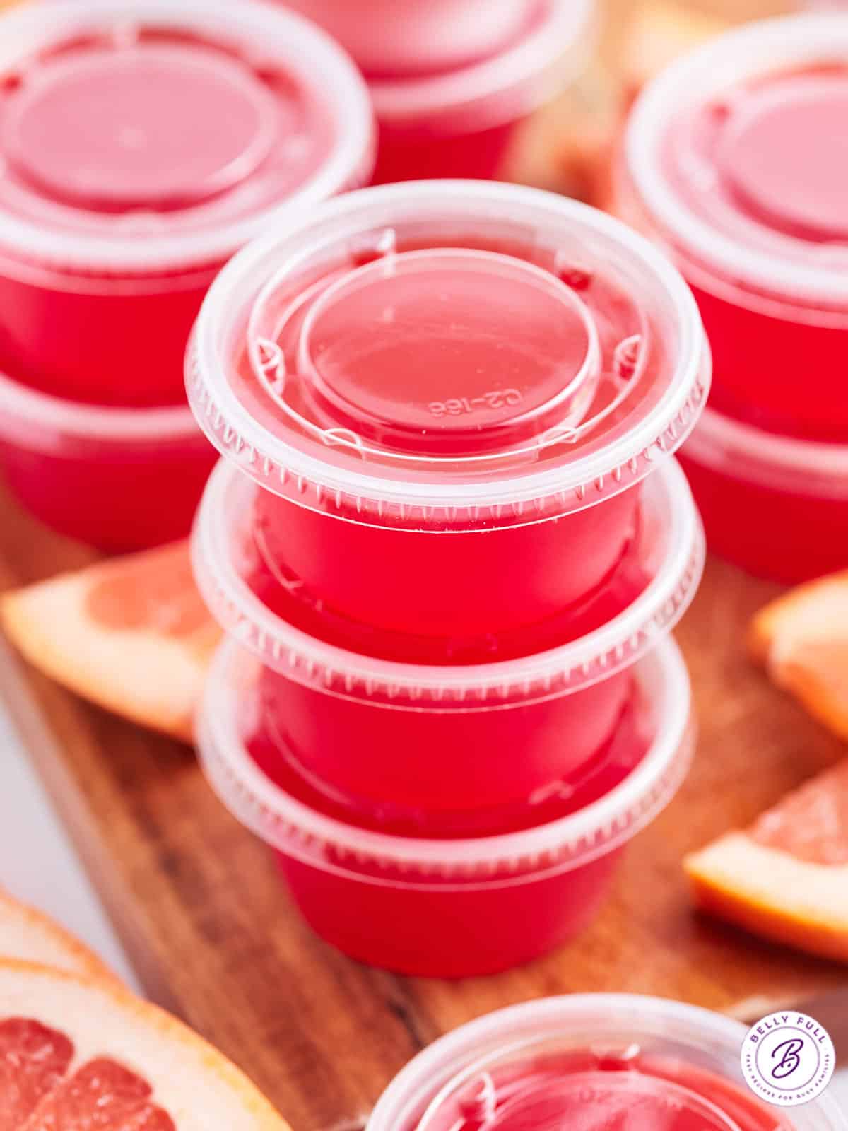 stack of 3 red jello shots with lids