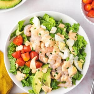 Overhead view of a bowl of shrimp louie salad