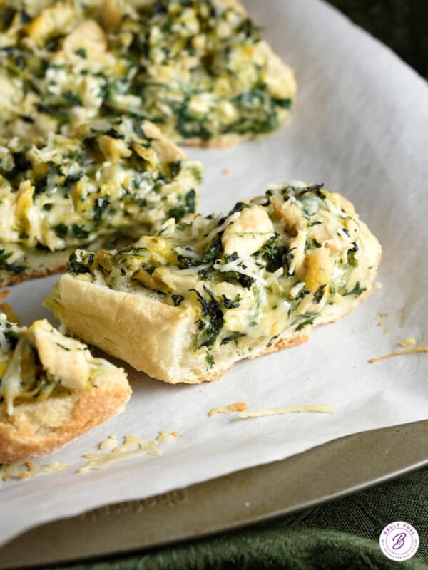 slice of spinach artichoke french bread pizza