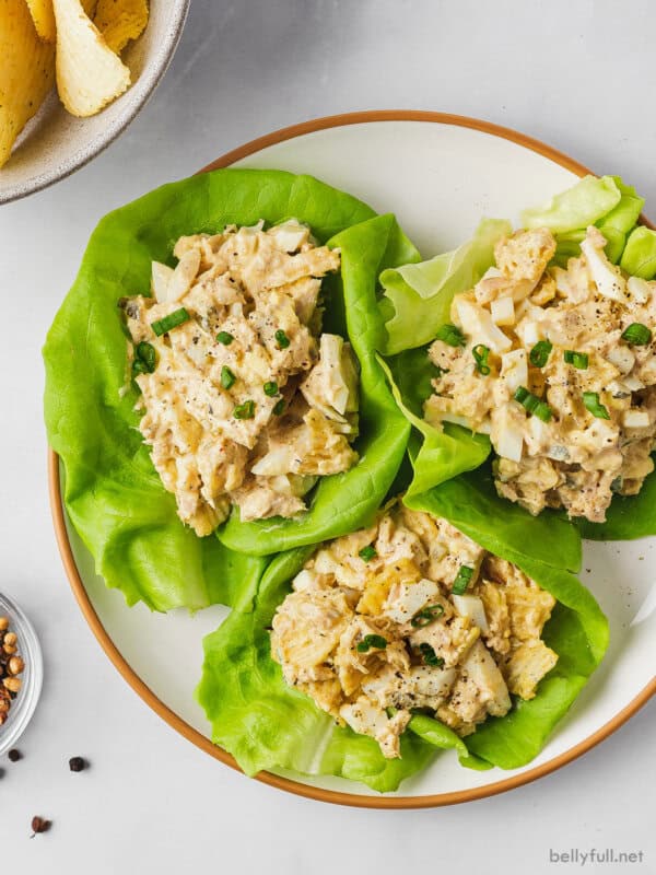 overhead 3 butter lettuce leaves topped with tuna salad