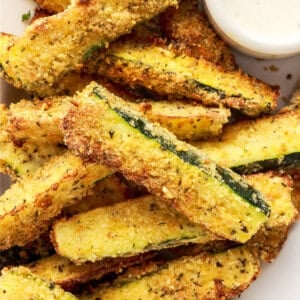 pile of air fryer zucchini fries on white plate