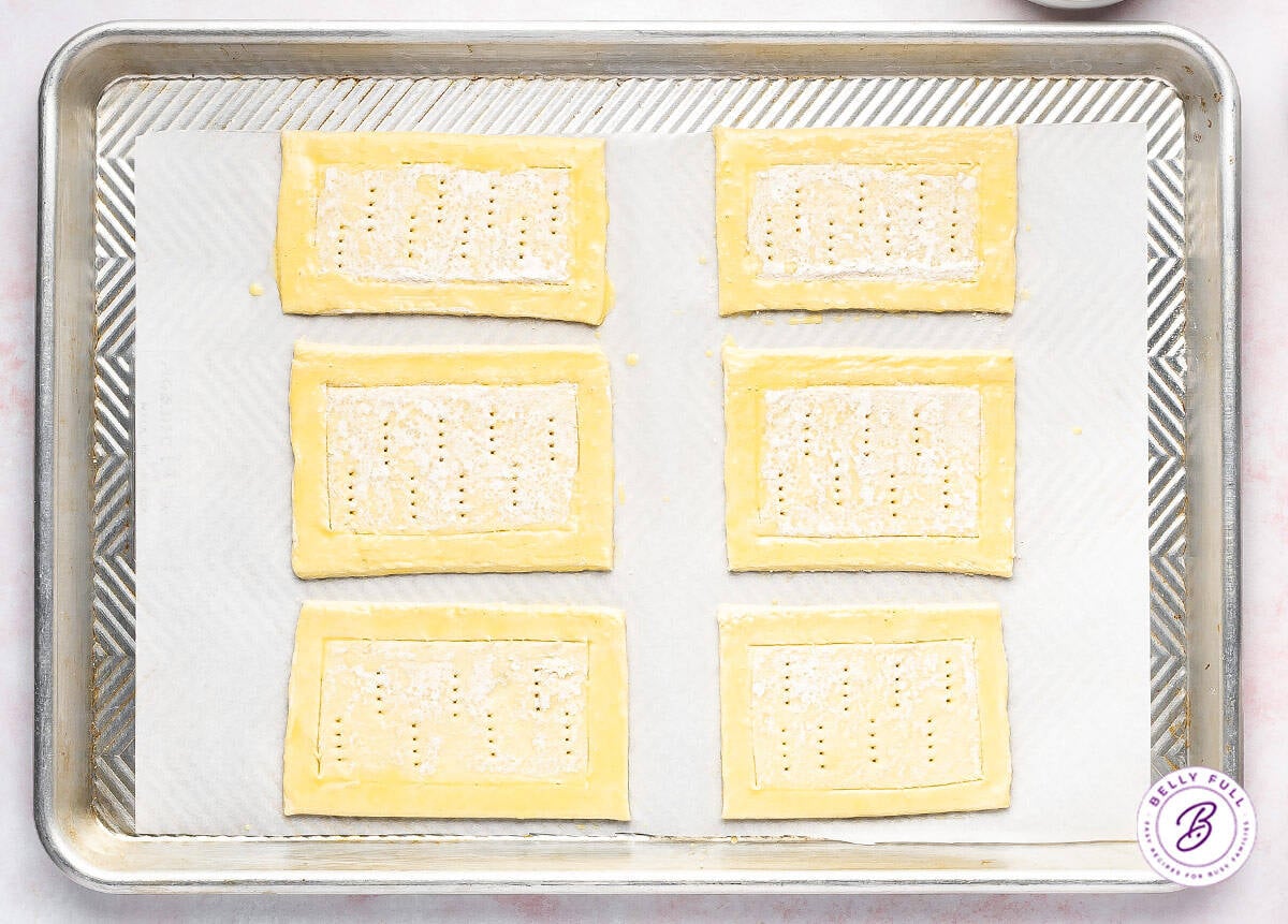 Brushing the outer edge with an egg wash.