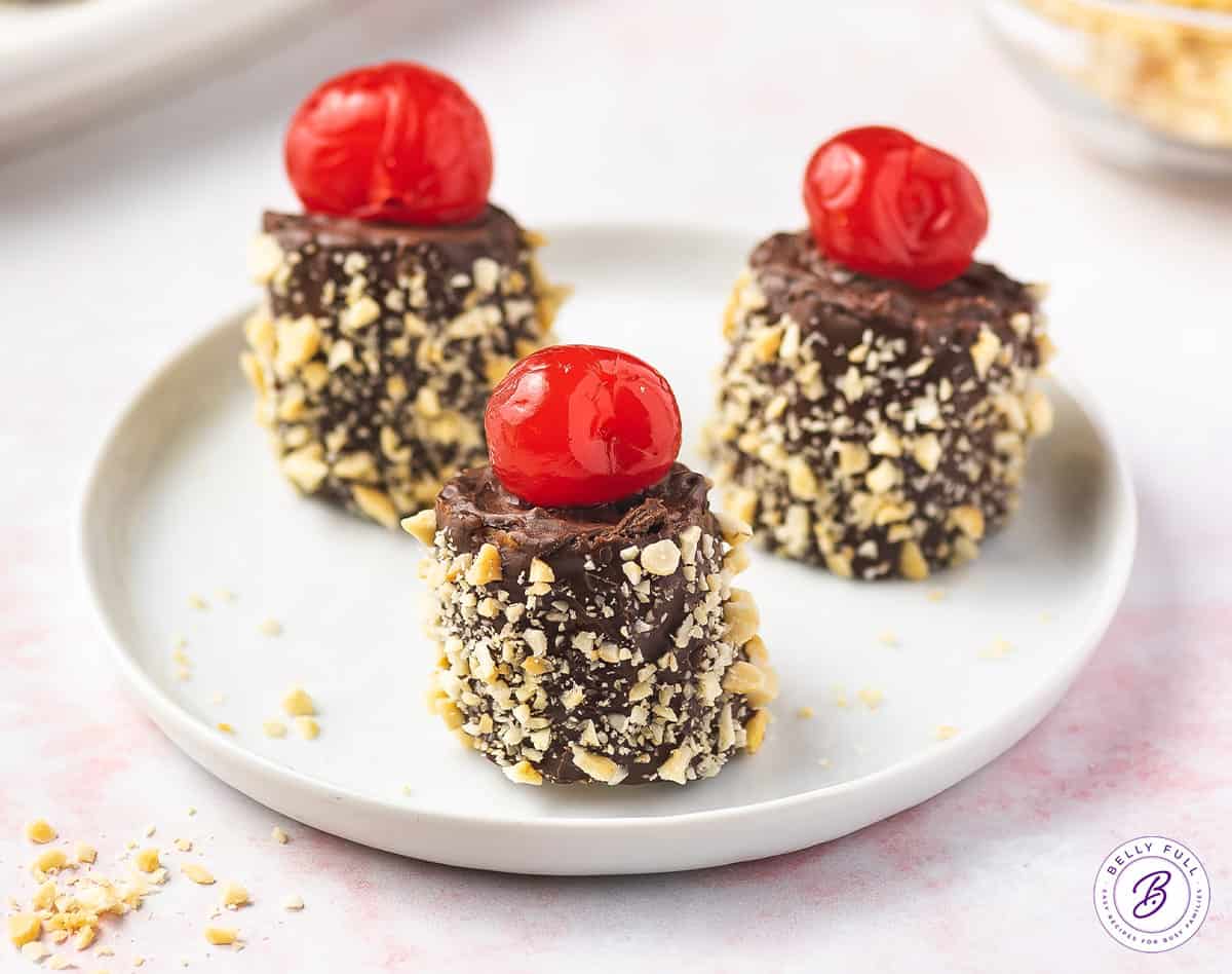 Frozen banana split bites on a white plate