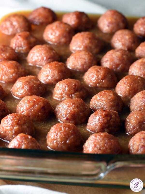 baking dish filled with cooked glazed ham balls