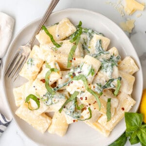 overhead Lemon Ricotta Pasta with fresh julienned basil on plate with fork