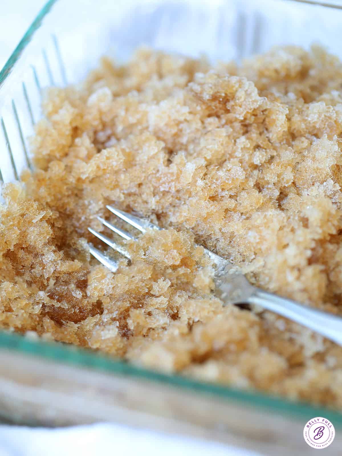 root beer granita in glass dish with fork