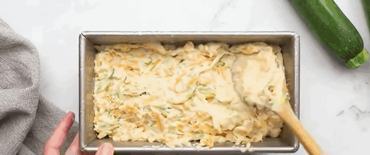 Transferring the dough to a loaf pan.