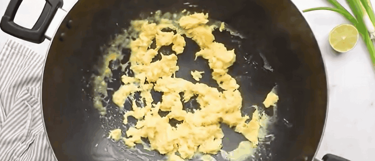 Cooking eggs in a wok.