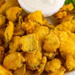 Overhead view of fried pickles with a bowl of ranch