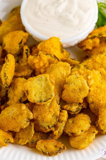 Overhead view of fried pickles with a bowl of ranch