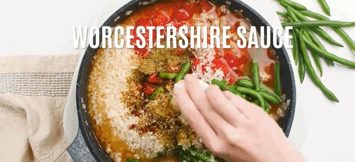 Ingredients to make ground turkey and rice skillet in a pan.