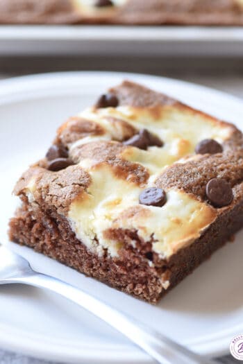 marble cheesecake square on plate with fork