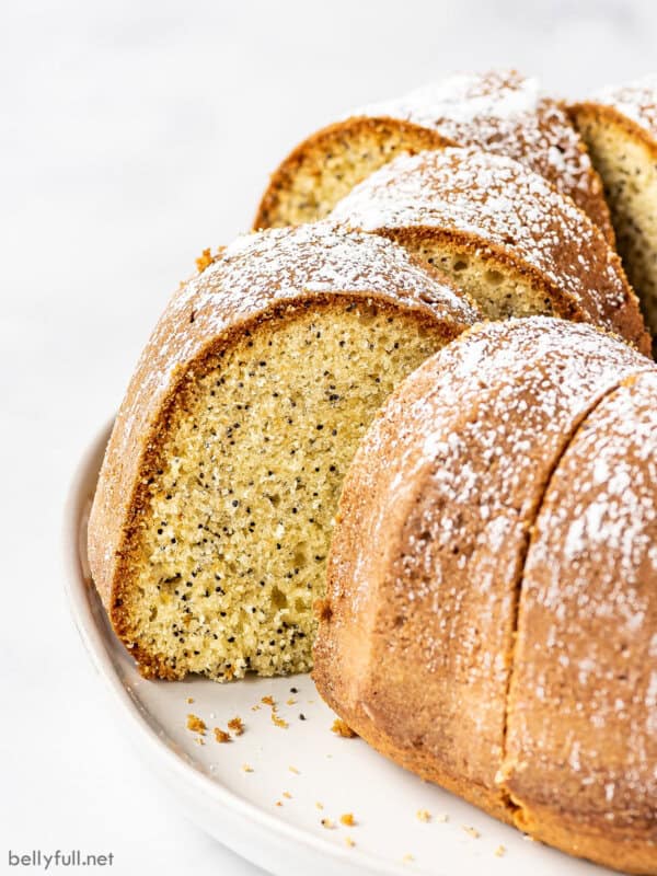 Angled view of a sliced poppy seed cake