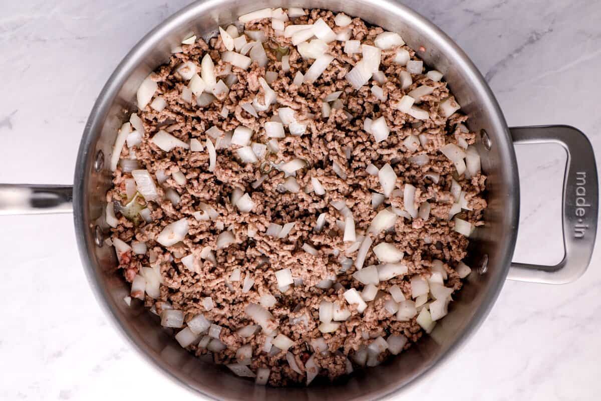 Cooking ground beef and onions.