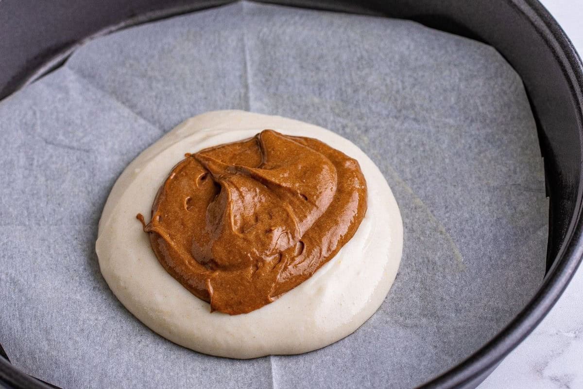 Mixing the chocolate and vanilla batters.