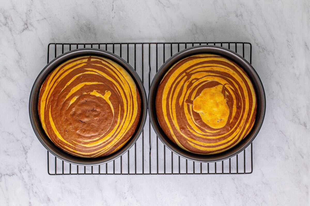 Baked zebra cakes on a cooling rack.