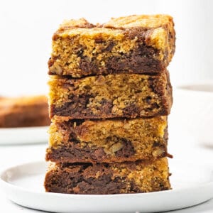 A stack of 4 chocolate chip cookie brownie bars