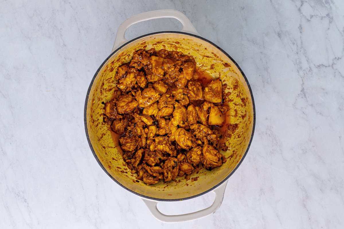 Marinated chicken in a Dutch oven.