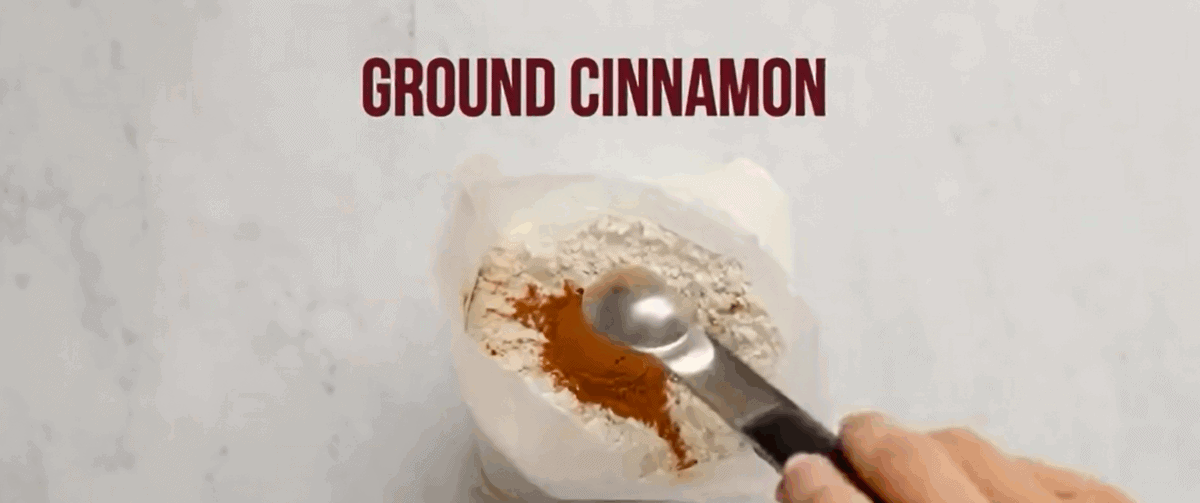 Adding cinnamon to the boxed cake mix.