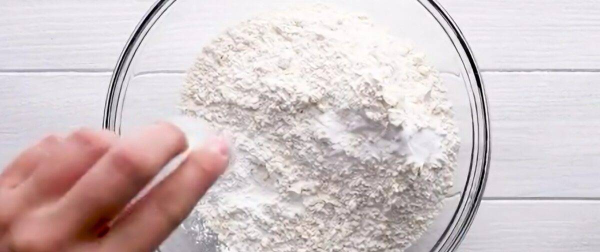 Combining the dry ingredients in a glass bowl.