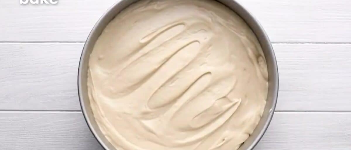 Transferring the batter into the prepared pan.