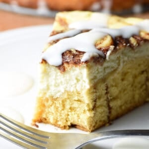 slice of cinnamon roll cheesecake with bite taken