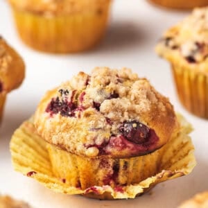 A close up of cranberry orange muffins out of the wrapper