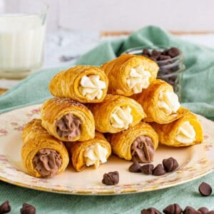 A plate piled with vanilla and chocolate cream horns