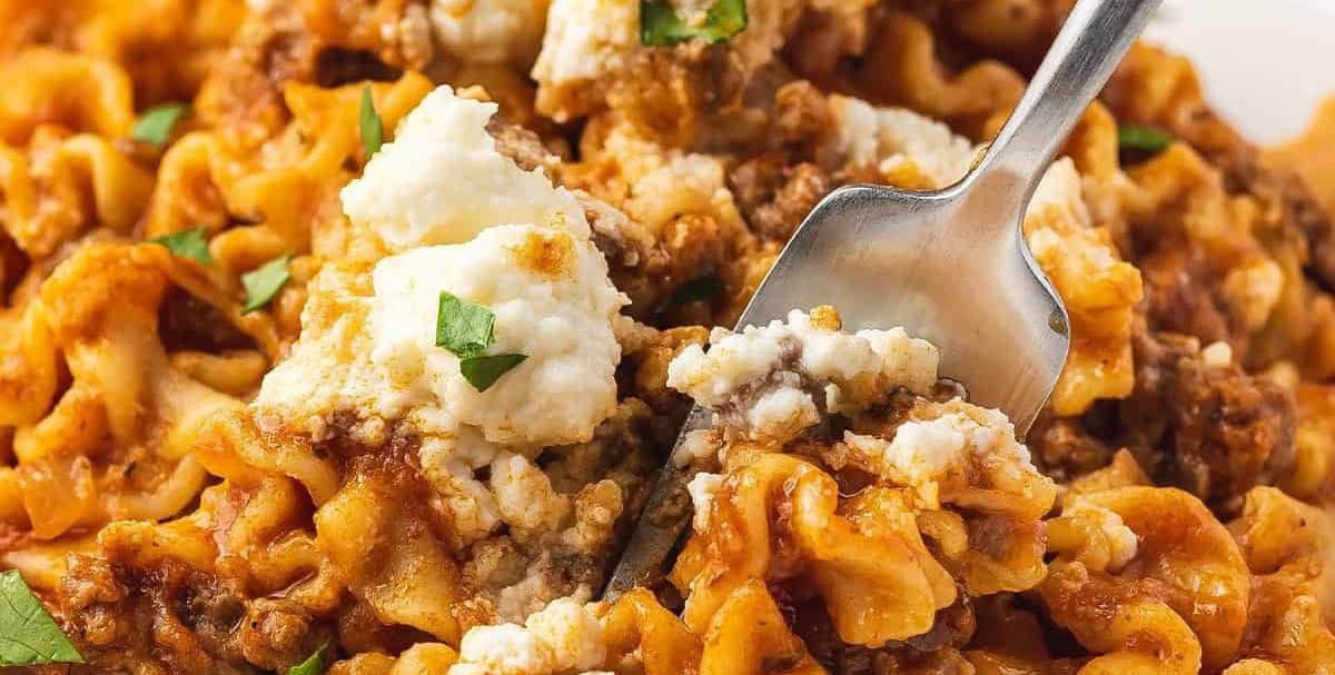 Skillet lasagna on a plate with a fork digging in.