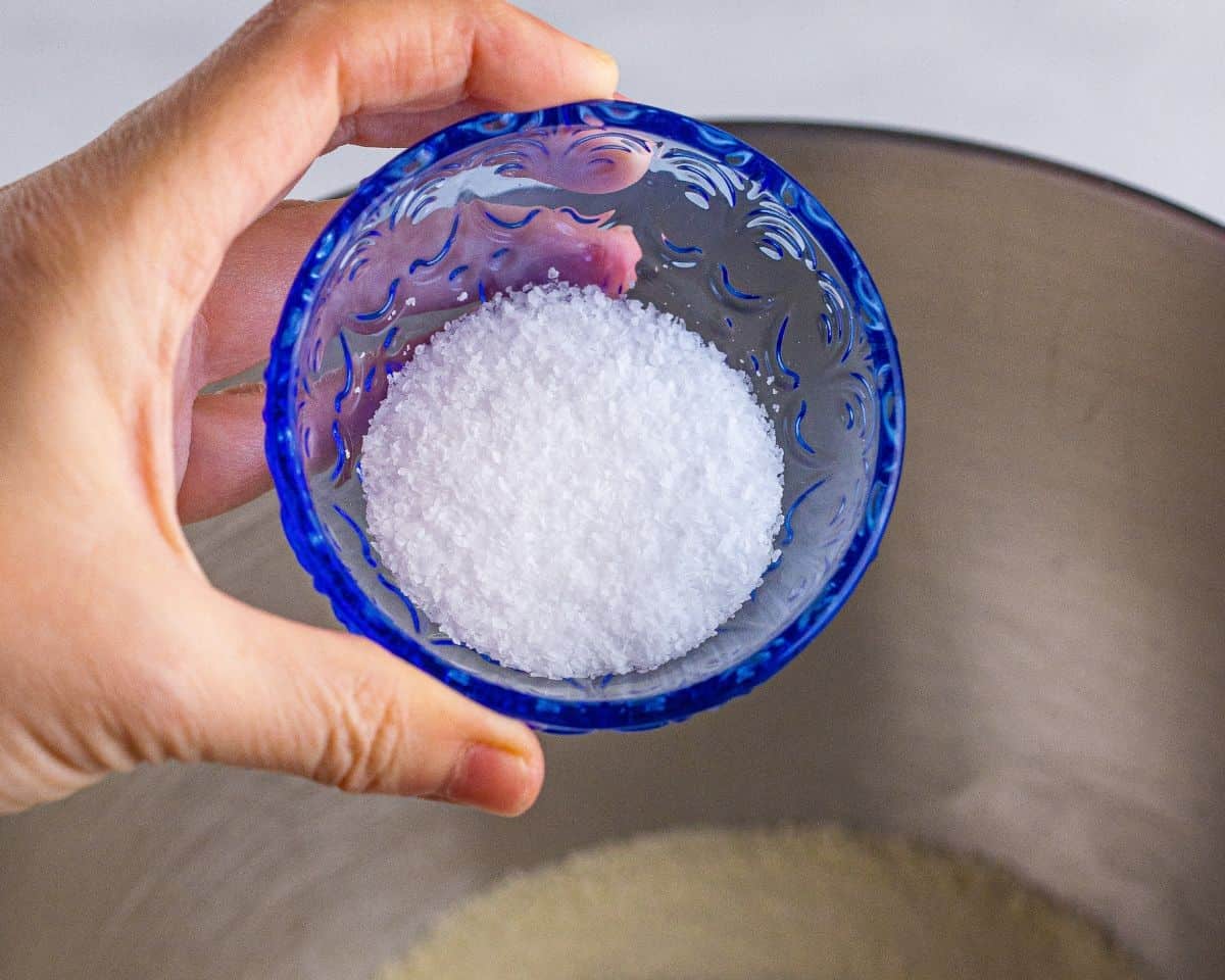 Adding ingredients to make the yeasted dough.